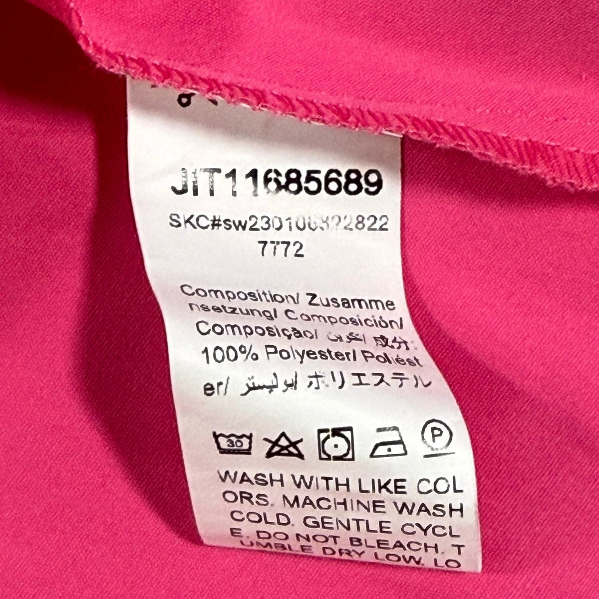 Care tag showing 100% polyester fabric and washing instructions for the SHEIN dress.