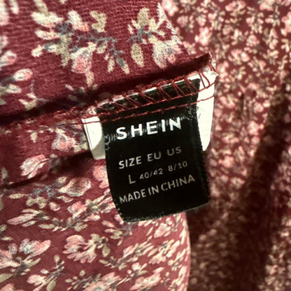 SHEIN clothing label showing women's size Large, EU 40/42, US 8/10.