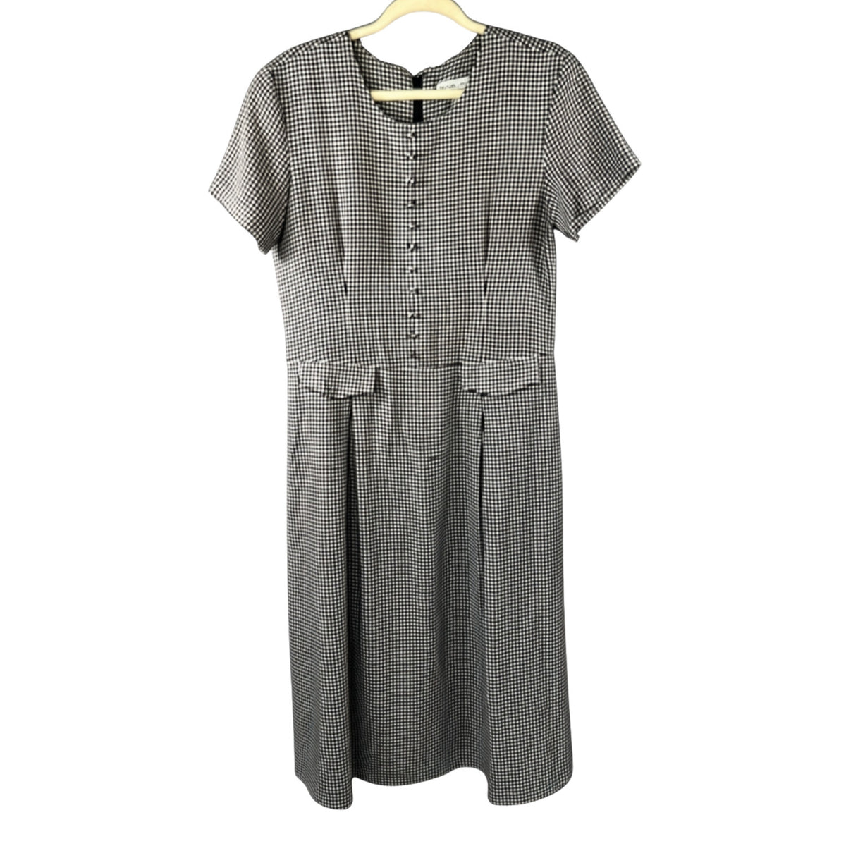 Front view of Stephanie Andrews women's size 8 black-and-white gingham midi dress with decorative buttons, pocket flaps, short sleeves, and pleated skirt.