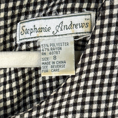 Stephanie Andrews women's size 8 dress label showing 53% polyester and 47% rayon fabric content.