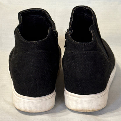 Back view of black Time and Tru ankle-height sneaker booties with contrasting white soles.
