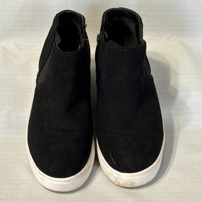 Front view of black Time and Tru sneaker booties showing rounded perforated toes, elastic side panels, and white soles.