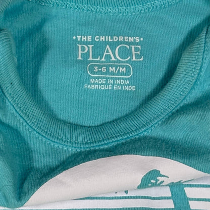 Baby boy turquoise onesie with Family Vacay beach graphic tag