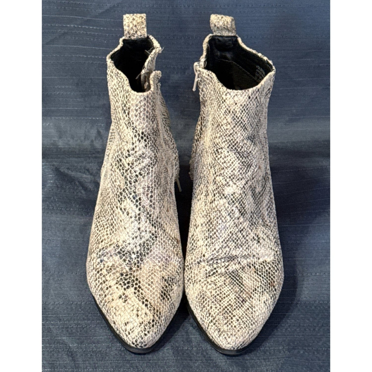 Front view of Very G women’s size 7 cream and taupe snake-print ankle boots with pointed toes.
