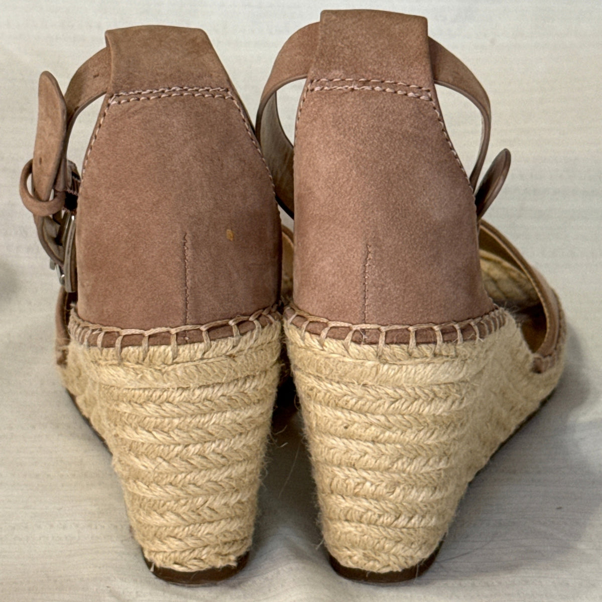 Back view of taupe suede Vince Camuto Leera wedge sandals showing closed heel counters and braided jute-wrapped heels.