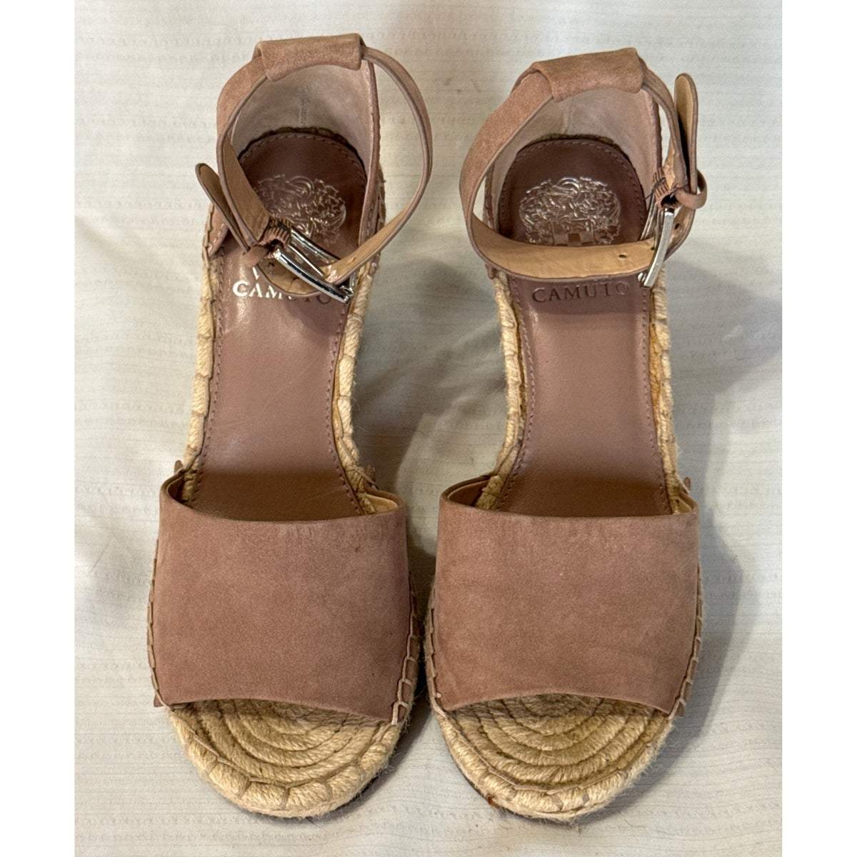 Front and top view of Vince Camuto Leera taupe suede wedge sandals with open toes and silver-tone buckle ankle straps.