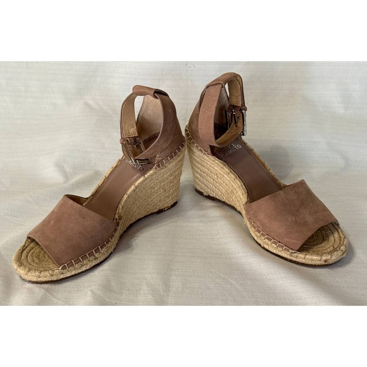 Angled view of Vince Camuto Leera taupe suede espadrille wedge sandals with jute-wrapped heels and ankle straps.