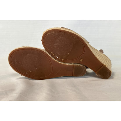 Bottom soles of Vince Camuto Leera taupe espadrille wedge sandals showing brown outsoles and signs of wear.