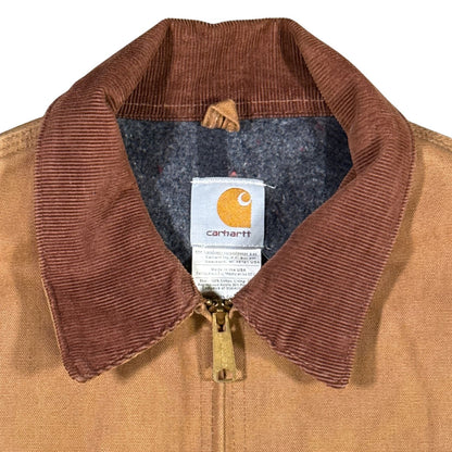 Close-up of brown corduroy collar, front zipper and Carhartt label on vintage J01 Detroit Jacket