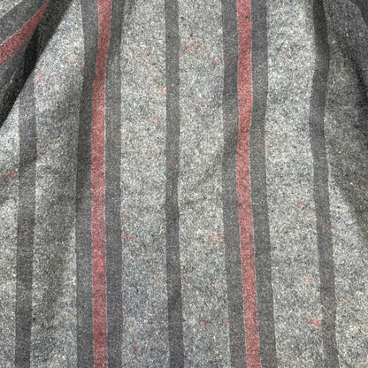 Close-up of gray, black and burgundy striped blanket lining inside vintage Carhartt jacket
