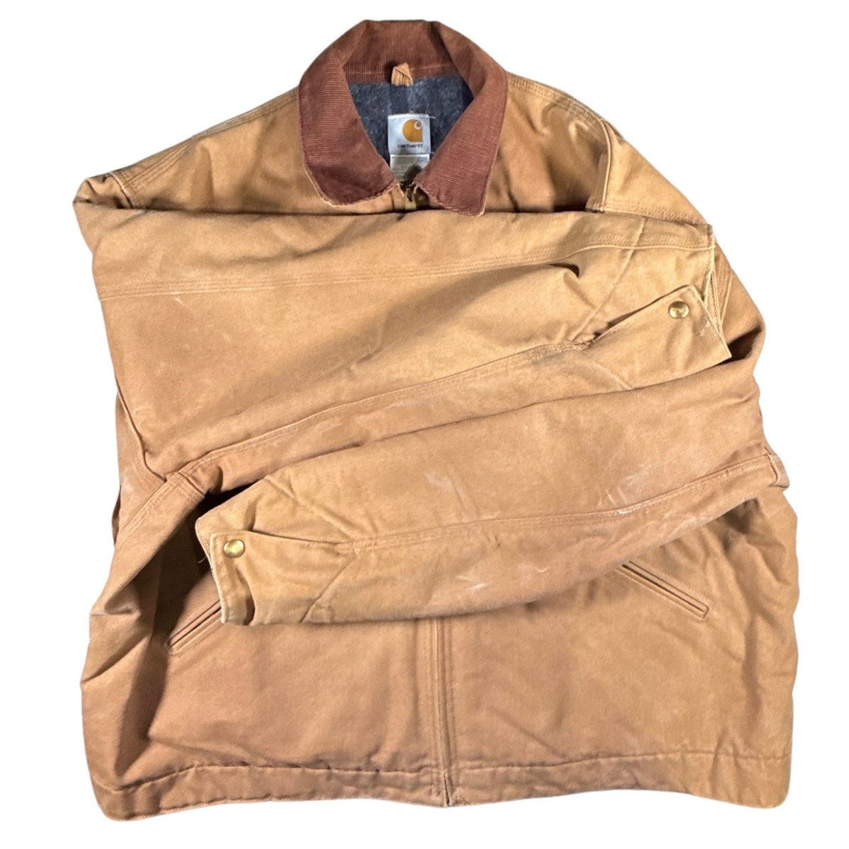 Underside view of both sleeves on vintage Carhartt J01 Detroit Jacket showing overall fabric and cuff condition