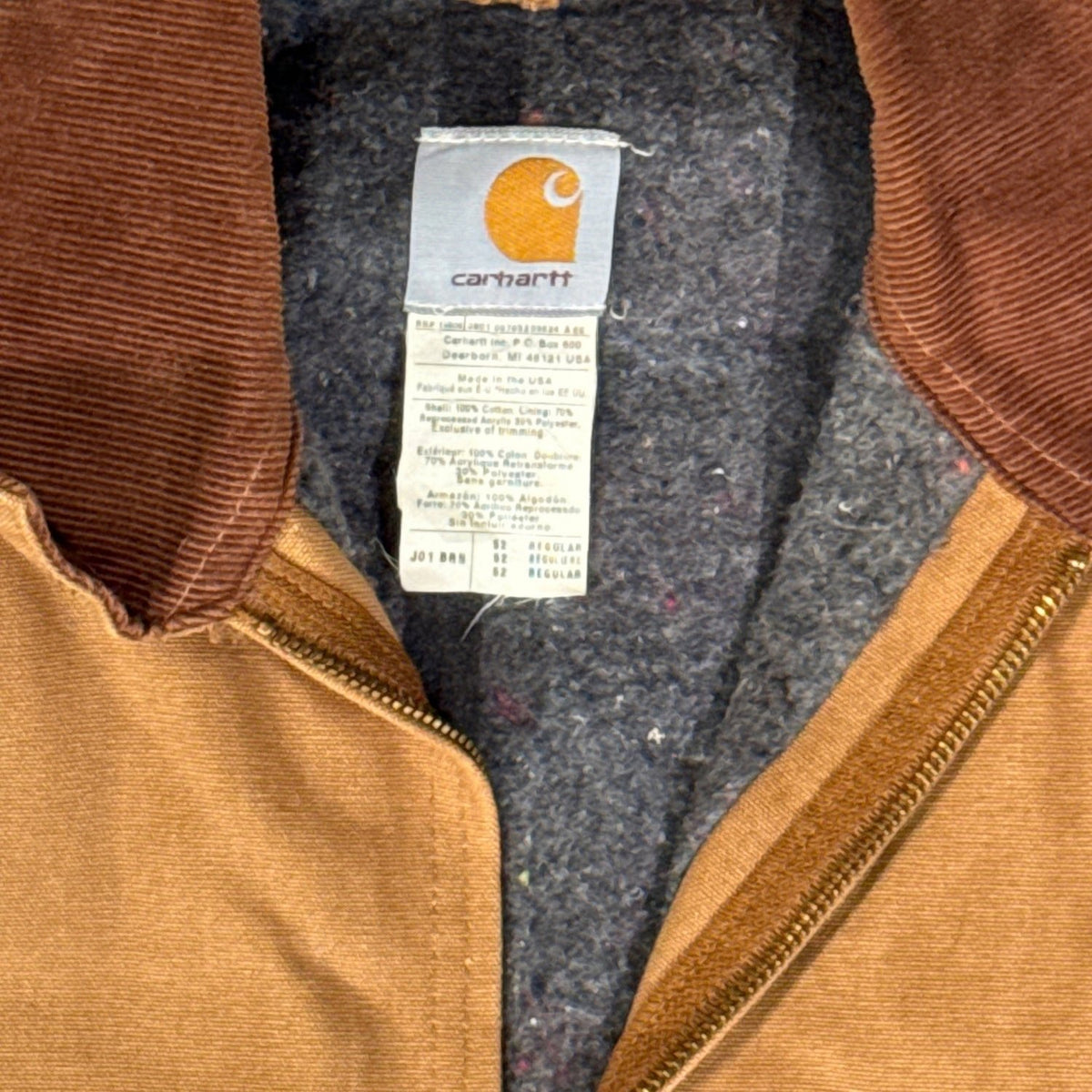 Carhartt neck label, brown corduroy collar and blanket lining inside vintage Detroit Jacket