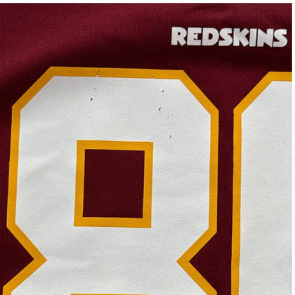 Close-up of small snags on front number 8 of Jordan Reed youth NFL jersey