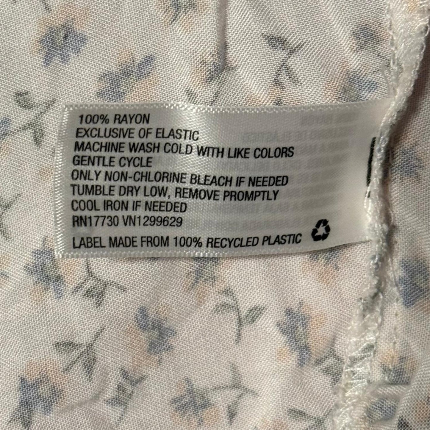 Material tag showing 100% rayon care instructions.