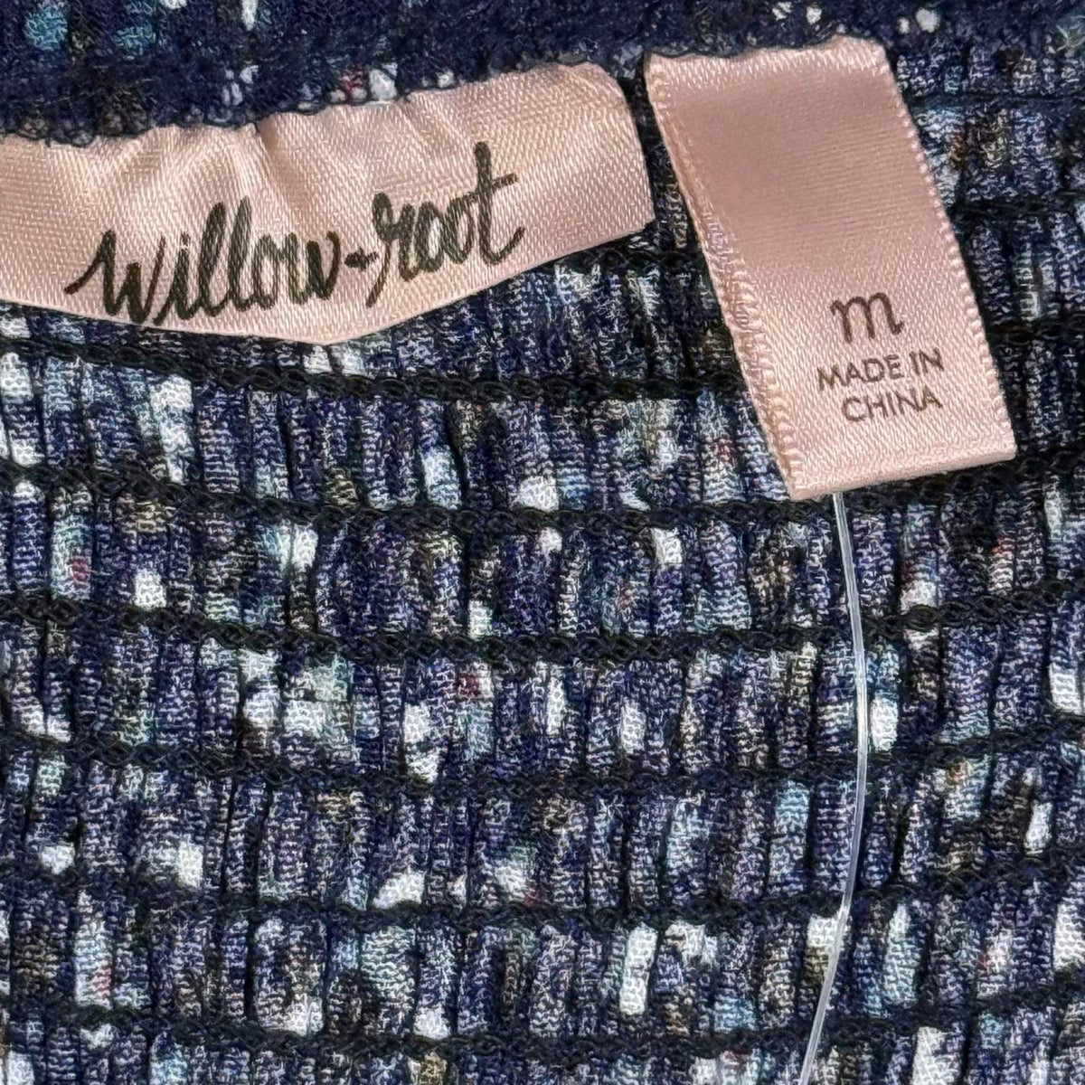 Willow + Root brand label on women's size Medium floral peplum top.