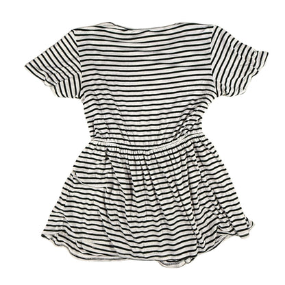 Back view of a women's large Magic Fit black and white striped peplum top.