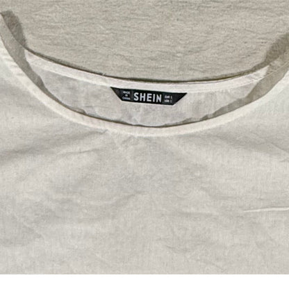 SHEIN brand tag on a women's large cream cotton top.