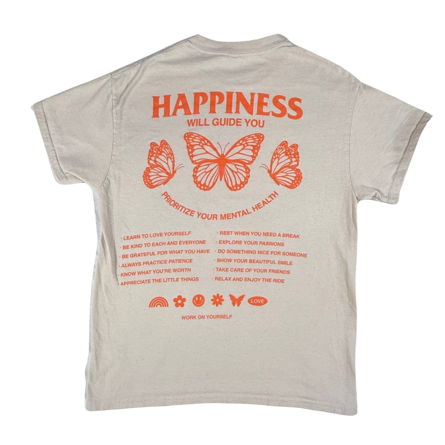 Back view of a women's medium Gildan tan graphic t-shirt with orange butterflies and "Happiness Will Guide You" design.