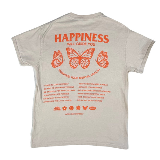 Back view of a women's medium Gildan tan graphic t-shirt with orange butterflies and "Happiness Will Guide You" design.