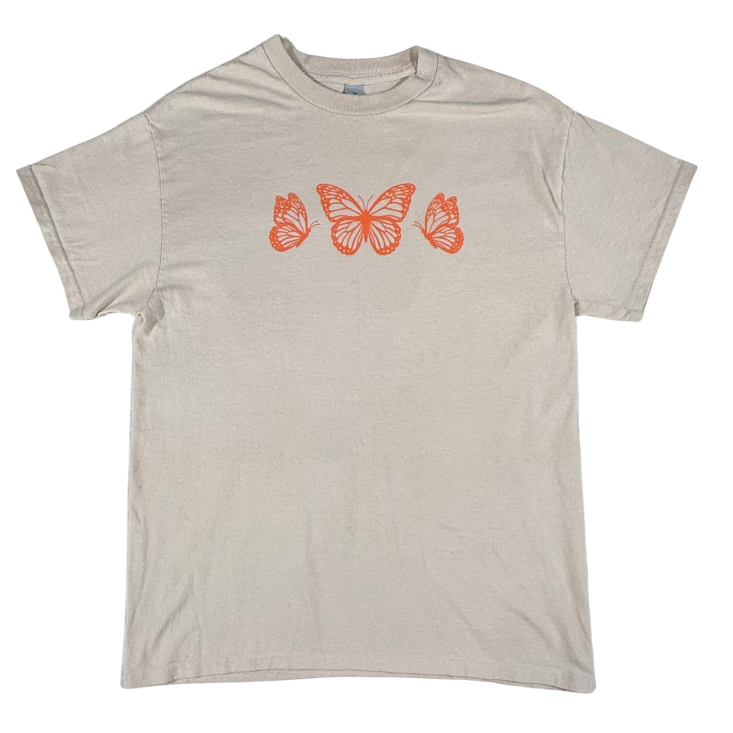 Front view of a women's medium Gildan tan graphic t-shirt featuring orange butterfly artwork.