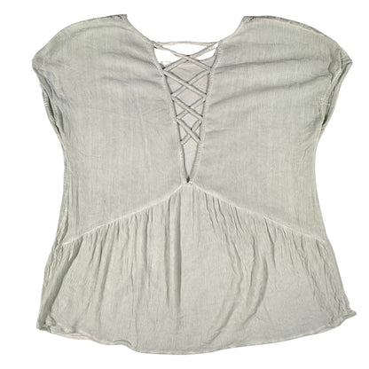 Back view of a women's medium Miss Me light sage green blouse featuring a crisscross back detail.