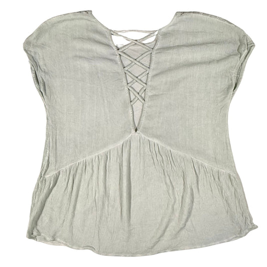 Back view of a women's medium Miss Me light sage green blouse featuring a crisscross back detail.