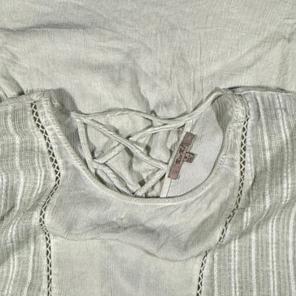 Miss Me brand tag on a women's medium light sage green blouse.