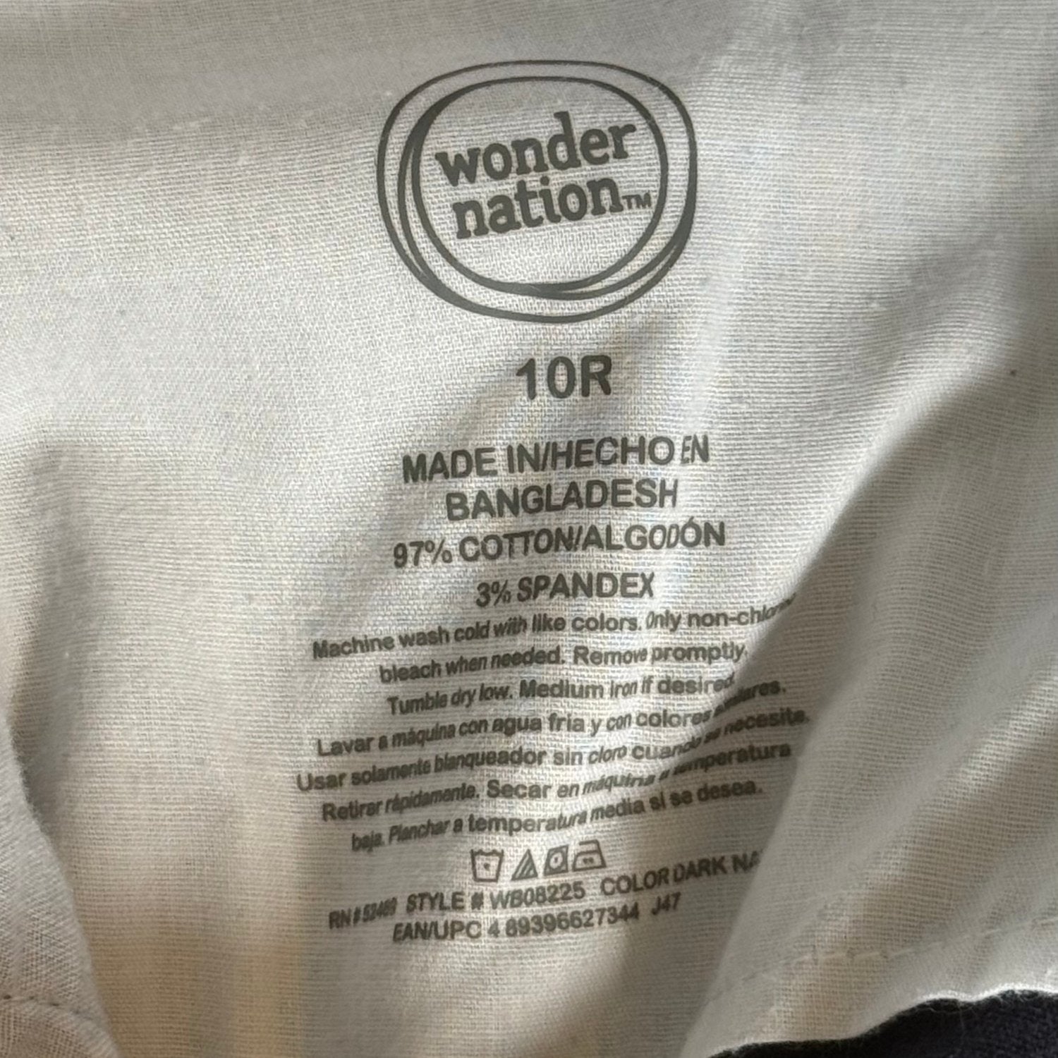 Wonder Nation boys size 10R brand and material tag showing 97% cotton and 3% spandex