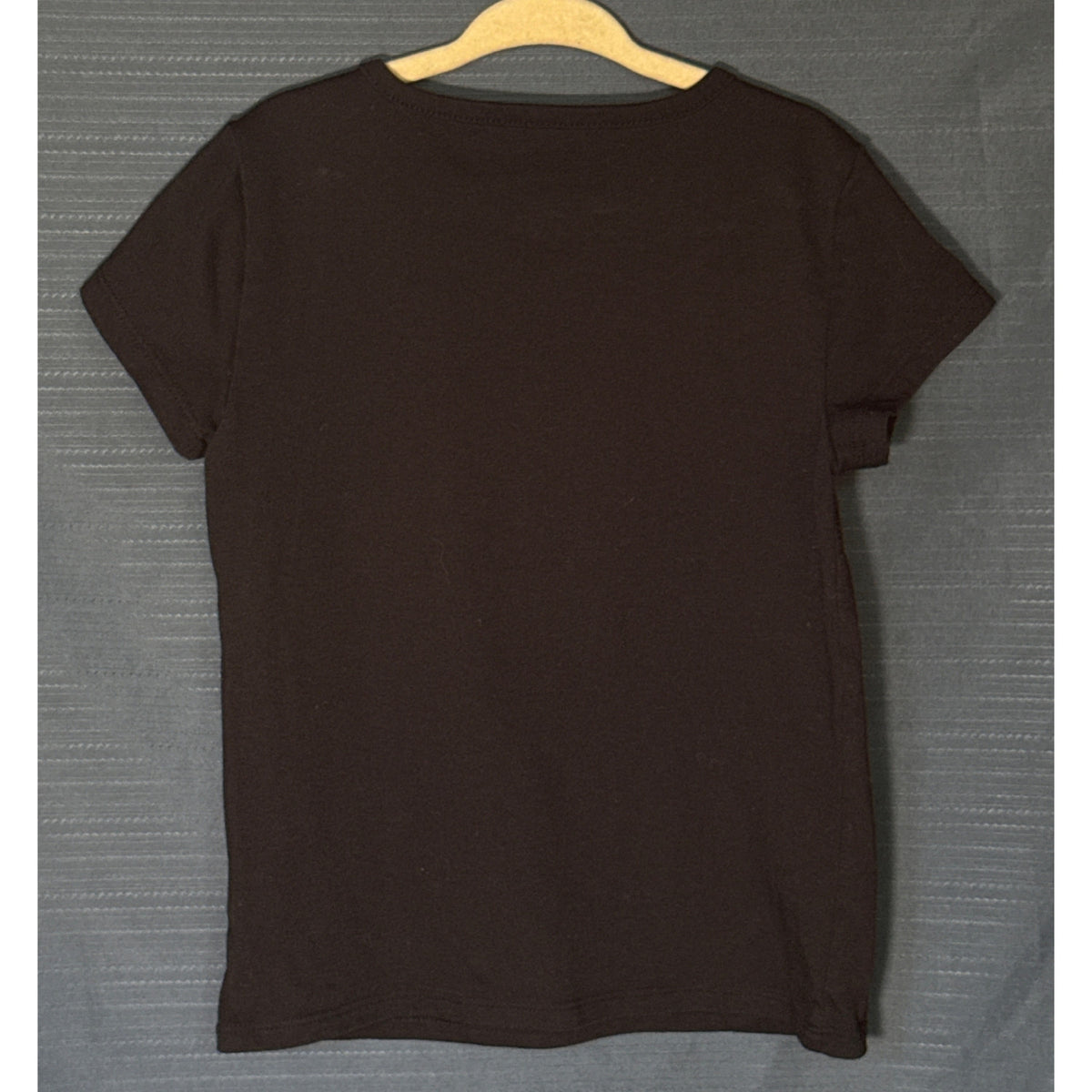 Back of Wonder Nation girls black short-sleeve crew neck T-shirt, size Small 6–6X.