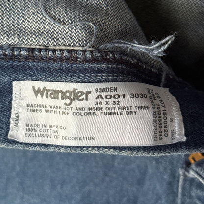 Wrangler jeans label showing size 34×32, 100% cotton, and made in Mexico