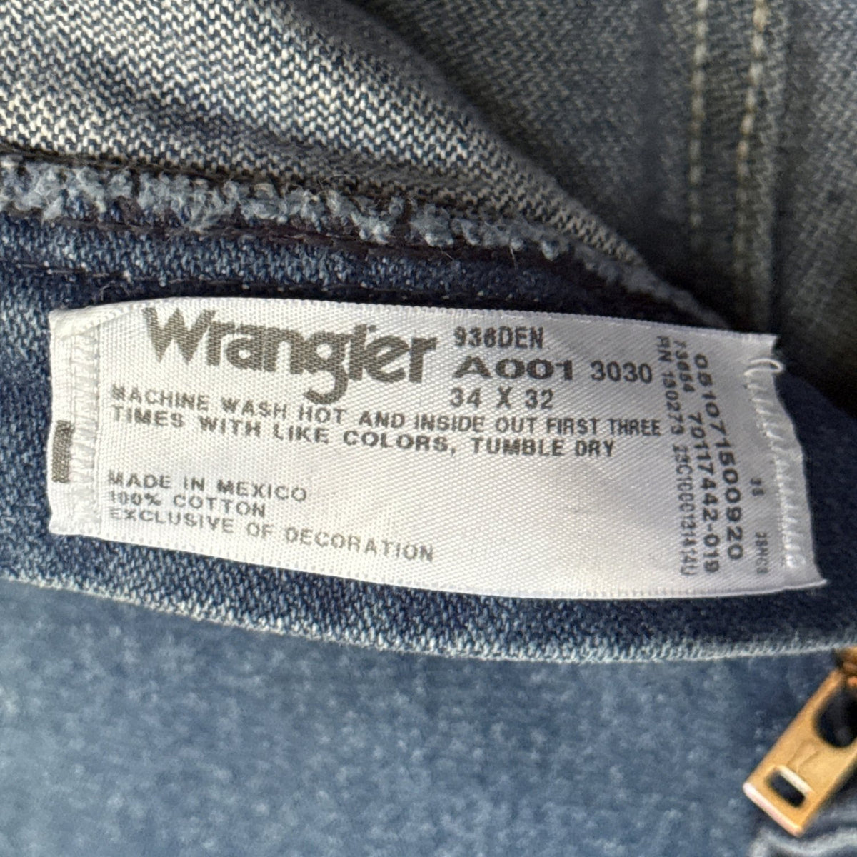 Wrangler jeans label showing size 34×32, 100% cotton, and made in Mexico