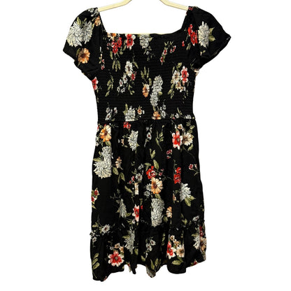 Back view of Xhilaration black floral smocked dress with flutter sleeves.