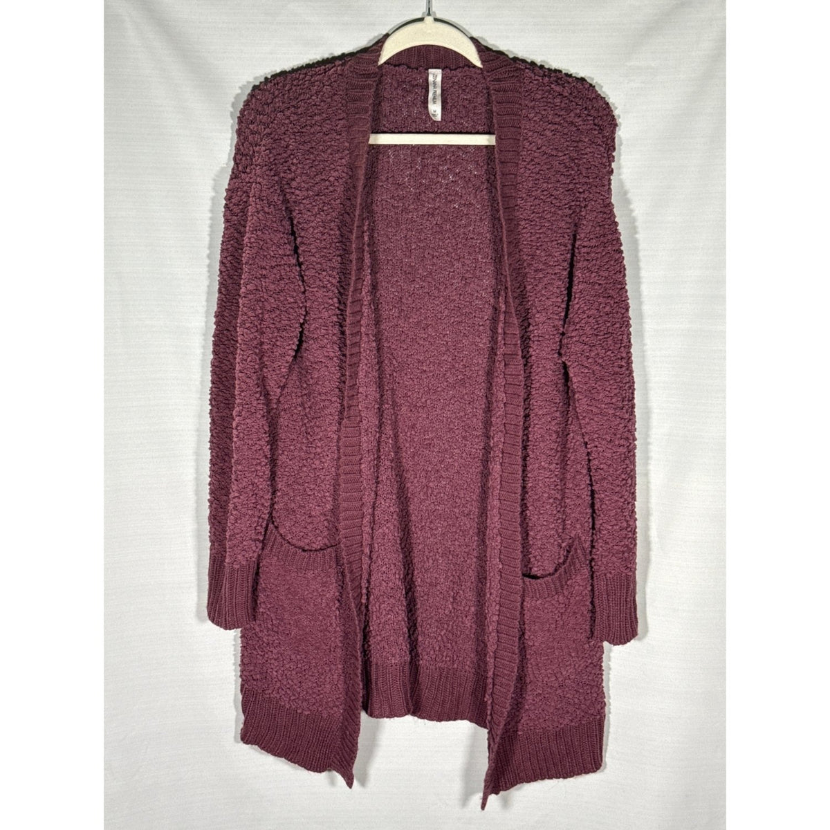 Front view of Zenana Premium women’s medium plum textured open-front cardigan with two pockets.