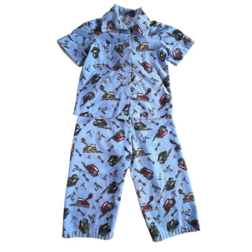 Pre-Owned Handmade Blue Flannel Pajamas Brand: Unbranded - Handmade, very well made Size: Toddler Boys 2T or 3T (best guess)* see measurements below Color: Blue with construction truck print Features: Short Sleeve Button-up Collar Chest pocket Elastic waist on pants Material: Flannel Condition: Well-Loved, some mild discoloration on the front tummy area and soft pilling. Used - Our Families Attic