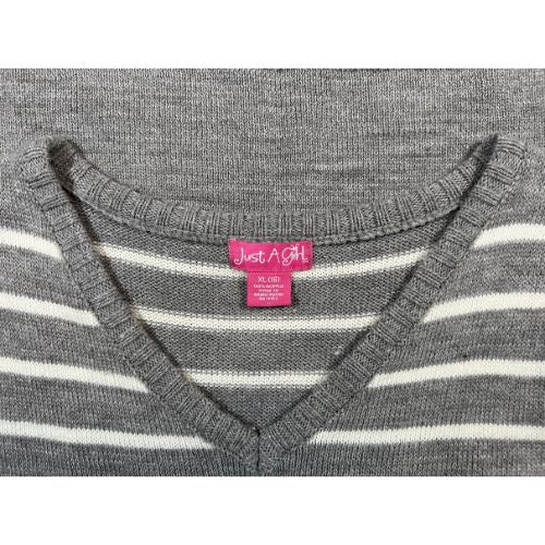 Just A Girl Gray and White Striped Sweater Dress (Est. Orig. Retail Price $36.00) Size: Big Girl Size 16 Color: Gray with white stripes Features: V-Neck, short sleeves, 2 front pockets, decorative buttons Material: 100% Acrylic Condition: Gently Used tag - Our Families Attic