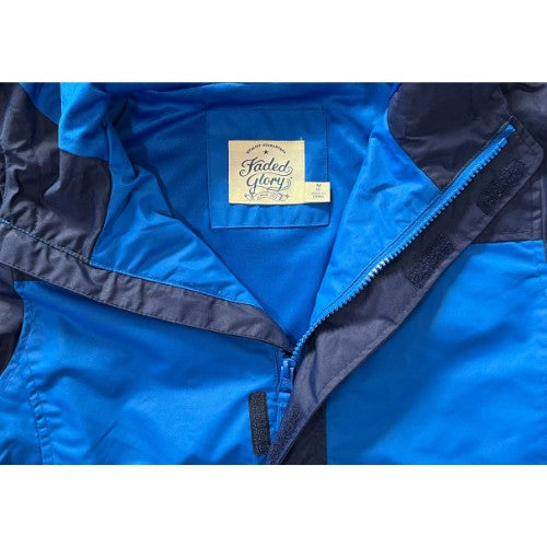 Pre-Owned Faded Glory Windbreaker Brand: Faded Glory Size: Big Boys 8 (medium) Color: Blue two-tone Features: Lightweight Long Sleeve Hood Zipper and velcro closure Front pockets Lightweight snow/ski-type jacket Large inside chest pocket Elastic around wrists and face Material: Cotton, Polyester Condition: Excellent Used Clothing - Our Families Attic